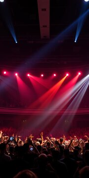 Rock concert stage lights shining bright on a crowded hall, rock show, concert hall