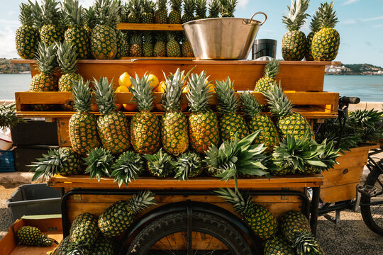 Fresh pineapples on food cart in Lisboa Portugal