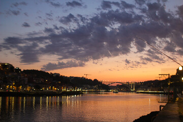 Naklejka premium Sunset over the Douro River in Porto, Portugal