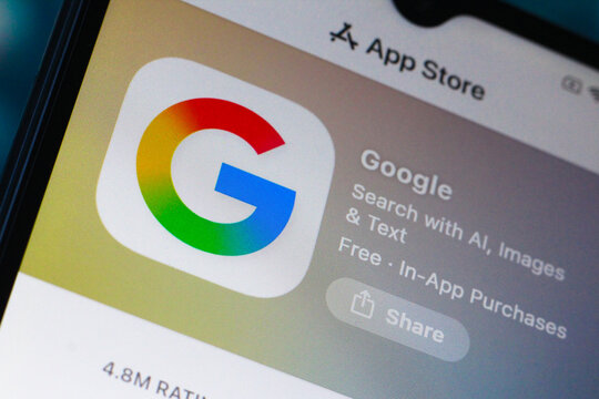 In this photo illustration, the Google logo is seen displayed on a smartphone screen in the Apple app store.