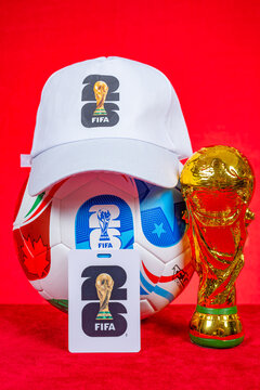 ZHONGSHAN China-July 18 2025: 2026 World Cup work card and soccer and hat and World Cup Trophy model at vertical.
