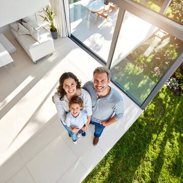 Happy family sitting on outdoor patio steps with dog.