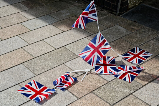 Union Jack British flags on ground after far right protest against illegal immigration in London
