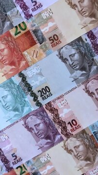 Brazilian paper money, real banknotes as currency for exchange or travel. Brazilian money as a business background