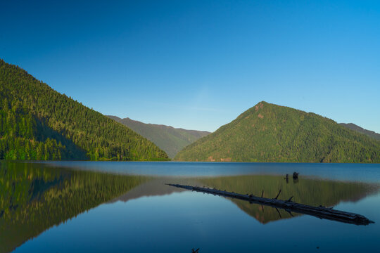 Crescent Lake, Olympica National Park scenic view with lake and mountains on a sunny clear day