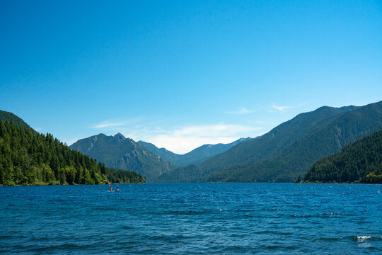 Crescent Lake, Olympica National Park scenic view with lake and mountains on a sunny clear day