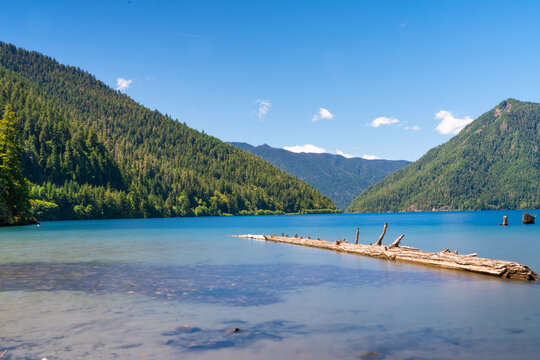 Crescent Lake, Olympica National Park scenic view with lake and mountains on a sunny clear day