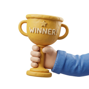 Hand holding yellow trophy with winner text, cookie or biscuit material