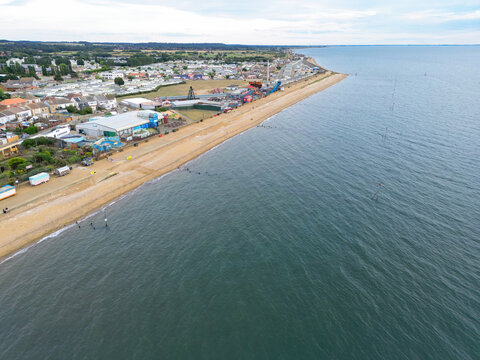 Interesting drone view of the famous seaside town showing various amusement arcades and fairground rides. The beach extends into nearby Heacham.