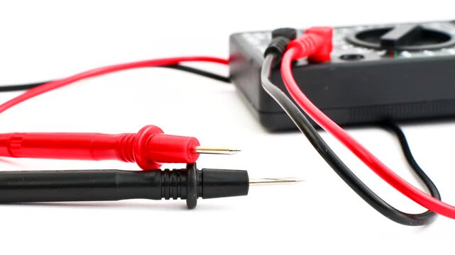 Close-up of a multimeter on a clear surface, highlighting precision and versatility for electrical measurements.