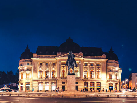 Central university library bucharest illumined at night with king carol i statue
