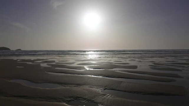 Sunset over the shoreline of Fistral Beach, Newquay, Cornwall on an idyllic June evening.