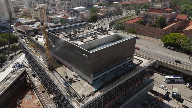 Modern construction site with crane and steel framework near Catavento Museum in S&atilde;o Paulo, Brazil. Orbit camera movement