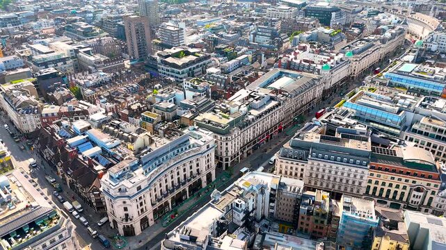 High-angle aerial shot of Regent Street, London&rsquo;s iconic shopping and business avenue, with curved facades, traffic, and city activity. Ideal for travel, retail, and urban business projects.