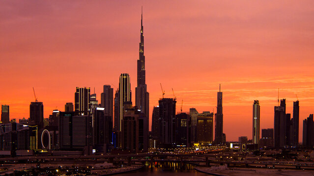 Burj khalifa and dubai cityscape during vibrant sunset