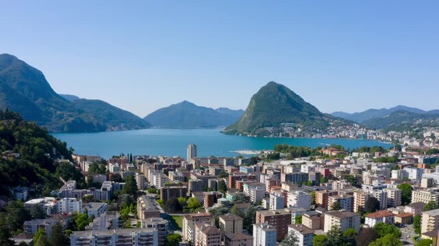  Lugano city aerial view with Lake Lugano and Monte San Salvatore mountain. Lugano, Canton of Ticino, Switzerland.