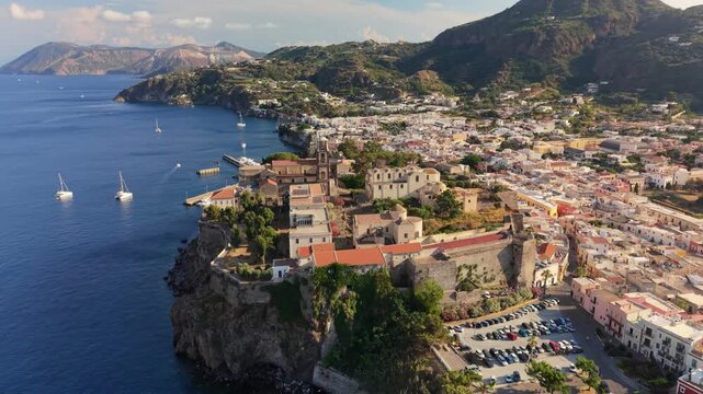 Scenic aerial view of the historic Lipari castle on a rocky cliff, beautiful panorama of Lipari island and the Mediterranean sea in Sicily. Historic fortress of Lipari, Aeolian islands, Italy