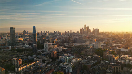 Fototapeta premium London city skyline at dramatic golden sunset aerial view