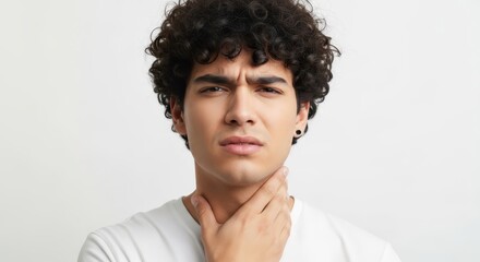 Obraz premium Young Man with Curly Hair Suffering from Sore Throat and Neck Pain Isolated on White Background