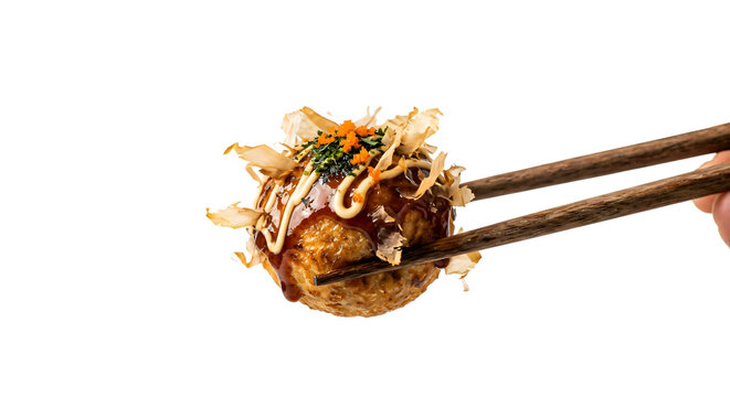 Traditional octopus ball between wooden chopsticks