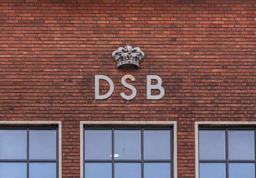 Brick facade with Danish railway sign DSB and crown at the railway station in Fredericia