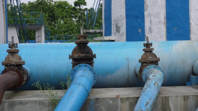 Industrial irrigation pipes with rusted metal valves