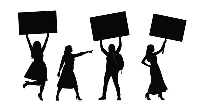 Silhouetted protesters marching with placards and signs during a street demonstration, conveying collective action and expression.