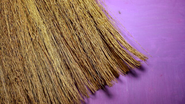 Close up of a traditional thatched roof with dried grass fibers, highlighting natural texture, handcrafted roofing, and sustainable rural architecture.