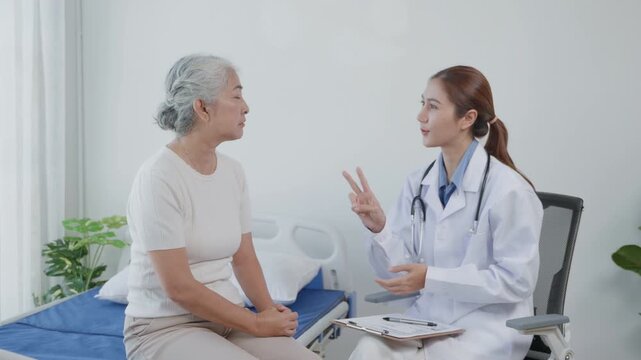 Female doctor talking with an elderly woman during a medical consultation in a clean clinic setting, representing healthcare, senior care, patient communication, and medical support.