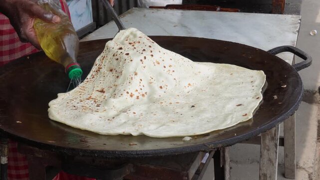 Turkish g&ouml;zleme cooking on traditional sac pan