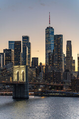 Sunset Skyline view of Lower Manhattan from an aerial view towards the Brooklyn Bridge and Financial District of New York City. © TBC