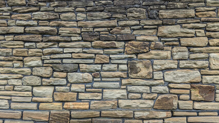 Fototapeta premium Rustic stacked stone wall texture background