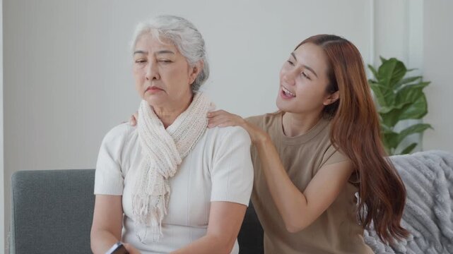 Young woman comforting her grandmother at home, representing family support, emotional care, compassion, elder care, healthy aging and multigenerational relationships.