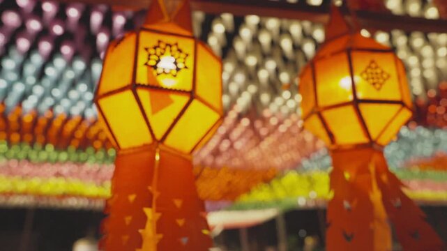 Shift Focus the display of red Lanna lanterns part of an exhibition featuring a million lanterns illuminating the city to symbolize faith.