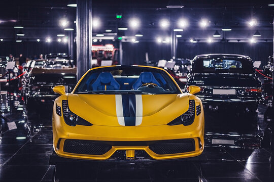 Yellow luxury sports car parked in automotive collection showroom