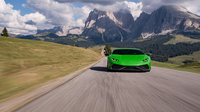 Green supercar driving on mountain pass road