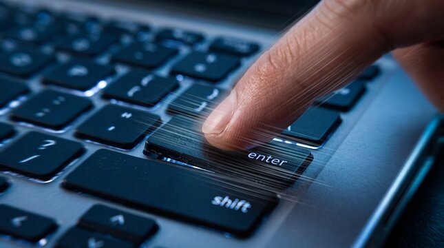 Person pressing the shift key on a laptop keyboard with a close-up view
