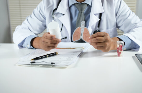Medical professionals present medications alongside anatomical images of the lungs and human respiratory system. Concepts of lung disease care and treatment.
