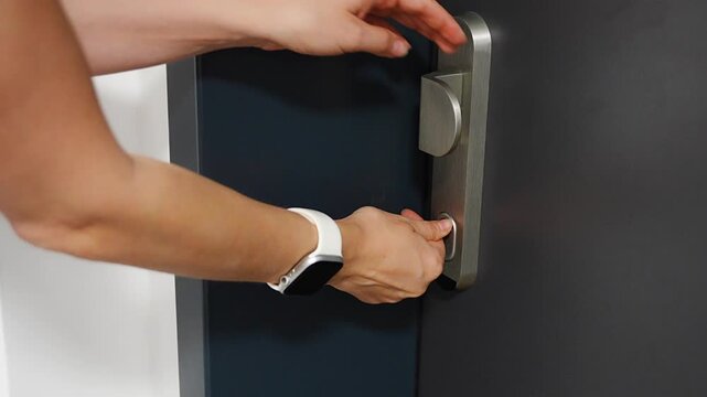 Person unlocking a residential apartment door with a key. Secure home access supports privacy safety and everyday property protection