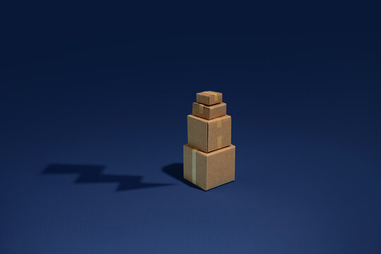 Stack of cardboard boxes on a blue background with a lightning
