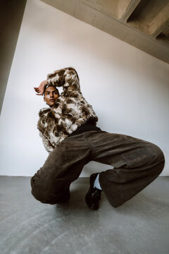 Model Poses in Urban Setting With Unique Outfit and Strong Stance