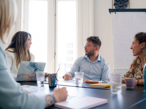 Group of colleagues having business meeting at office 