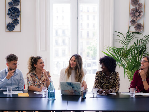 Group of people having board meeting at office 