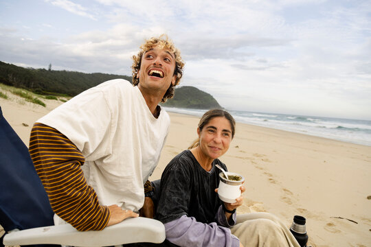 UGC couple on beach with mate and expressive gesture