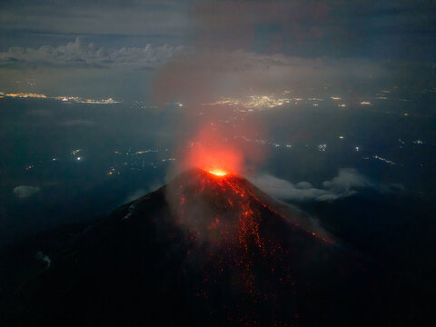 Active volcanic crater illuminating the darkness in Guatemala