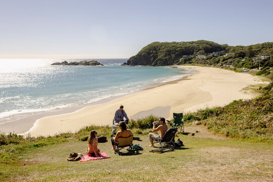 UGC friends relaxing above Seal Rocks beach in NSW Australia