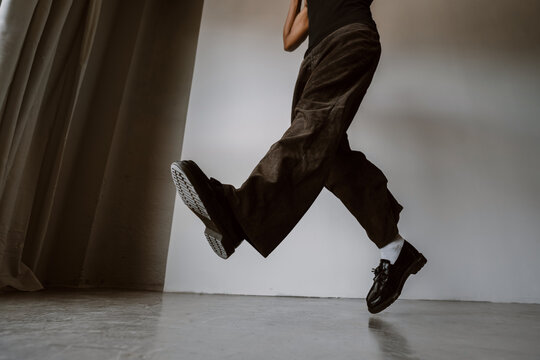 Dancer Performs a Jump During a Practice Session in a Studio
