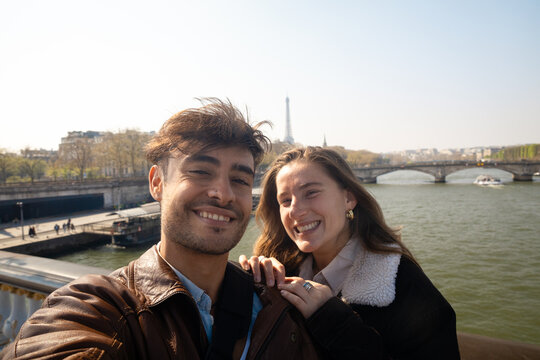 Happy tourists taking selfie in Paris