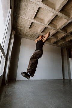 Contemporary dancer jumping in studio