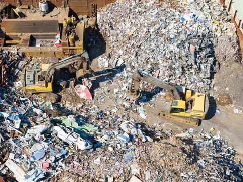 Aerial View of Two Excavators at Scrapyard Recycling Site